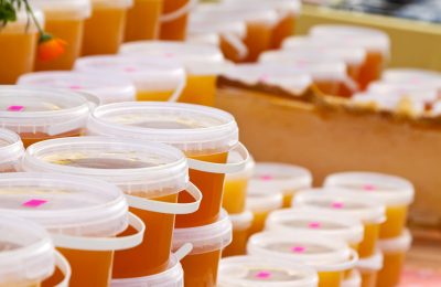 assortment of honey on counter in market